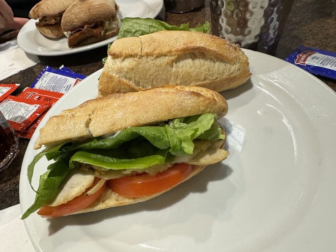 Baguette sandwiches on white plates